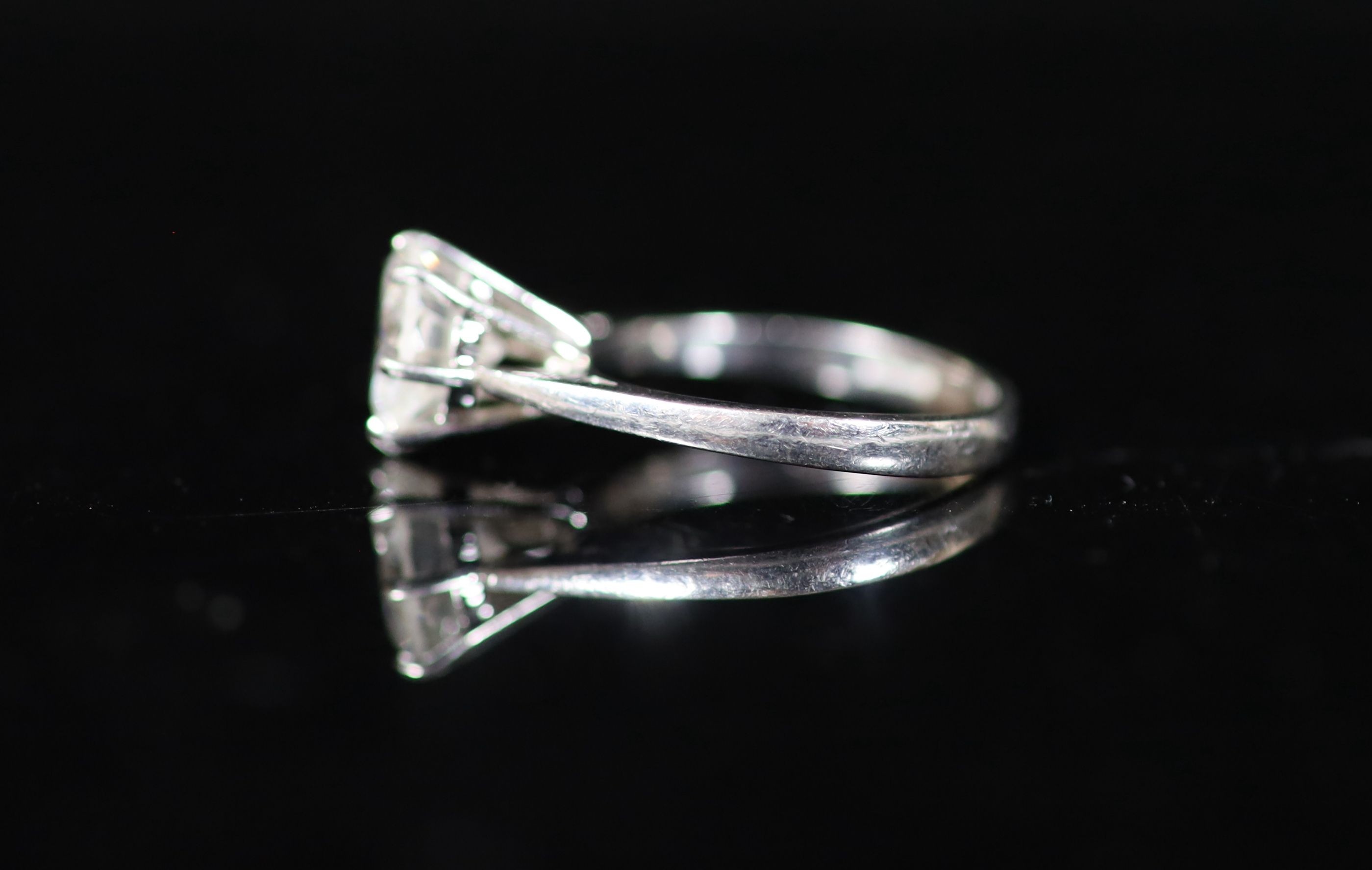 A modern platinum and solitaire diamond ring